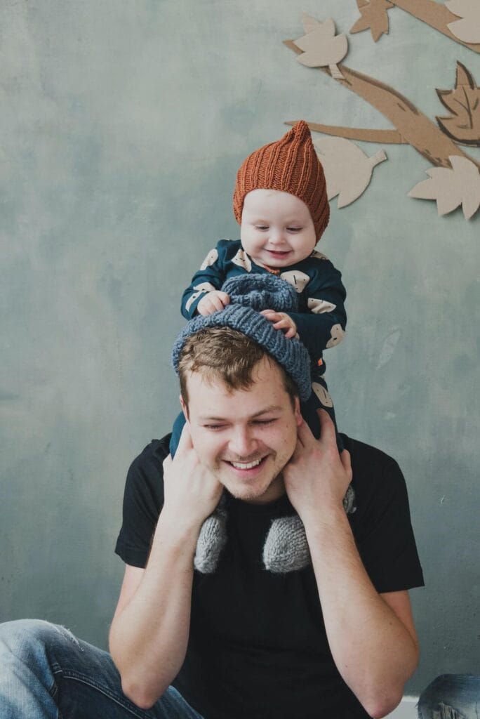 Father carrying his young son on his shoulders